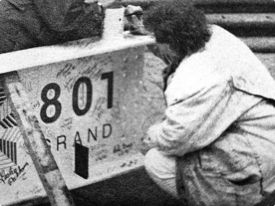 Principal employees signing an 801 Grand beam